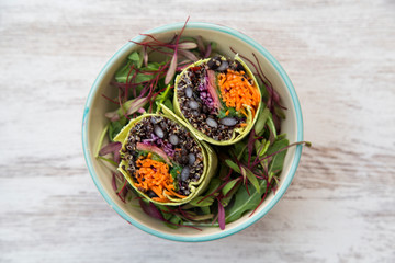 Spinach wrap stuffed with Norwegian salmon sauteed with teriyaki sauce, black quinoa, wakame, lemon onion.