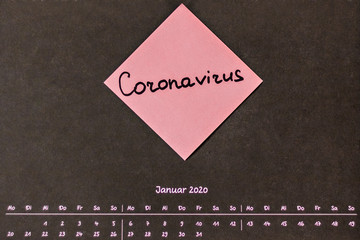 Calendar on the wall with January notes on coronavirus and quarantine in Wuhan. New...