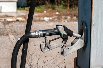 Old abandoned vintage obsolete petrol fuel gas dispenser in former petrol station