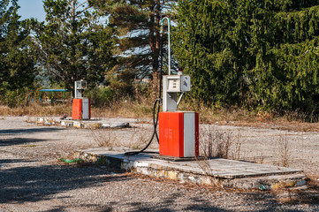 Old abandoned vintage obsolete petrol fuel gas dispenser in former petrol station