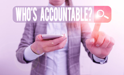 Text sign showing Who S Accountable. Business photo showcasing answerable for something within one power or control Business concept with mobile phone and business woman