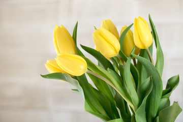 Bouquet of yellow tulips in natural light. Spring flowers.