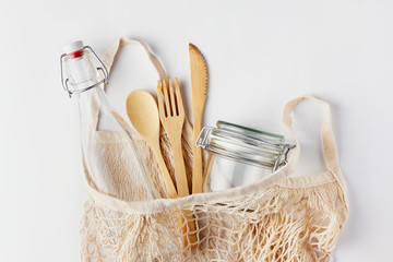 Zero waste, plastic-free and eco-friendly lifestyle. Cotton mesh bag, glass bottle, jar and bamboo...