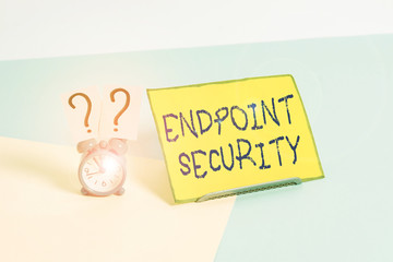 Word writing text Endpoint Security. Business photo showcasing the methodology of protecting the corporate network Mini size alarm clock beside a Paper sheet placed tilted on pastel backdrop