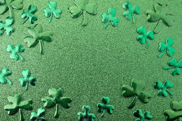 Elegant and shiny St. Patricks Day background. Green glitter and clover
