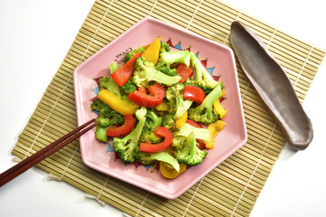High angle shot of various vegetable on the pink plate