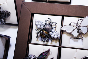jewelry retail showcase display different bee brooches