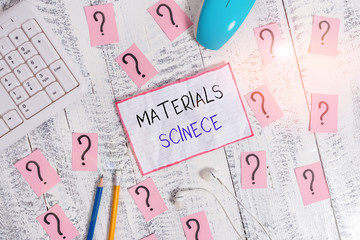 Handwriting text Materials Science. Conceptual photo interdisciplinary field involving the properties of matter Writing tools, computer stuff and math book sheet on top of wooden table