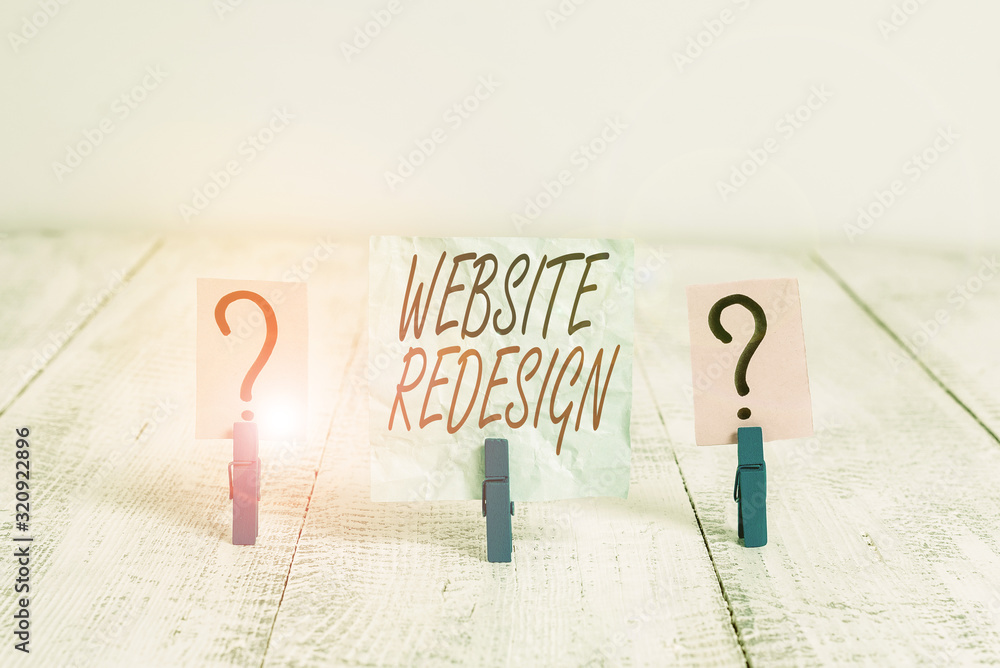 Wall mural writing note showing website redesign. business concept for modernize improver or evamp your website