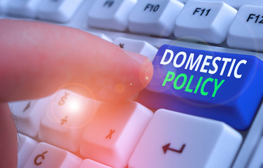 Writing note showing Domestic Policy. Business concept for Actions taken by a national government...