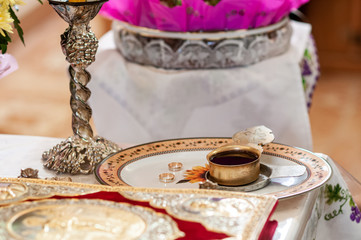 church silver chalice with wine on the plate