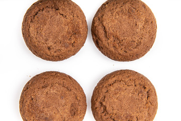 Brown chocolate chip cookies with soft tasty filling inside on a white background