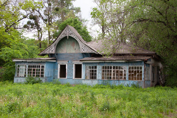 Old lonely wooden house with broken windows