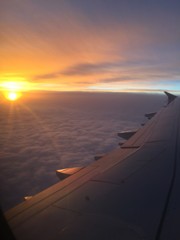 Fototapeta na wymiar sunset from an airplane window