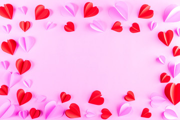 Pink and red hearts on pastel pink paper background. Copy space. Valentines day, Women's day, Mother's day concept.