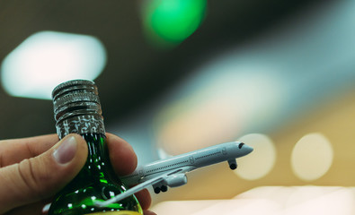 Alcohol. Drink alcohol before flying on an airplane.