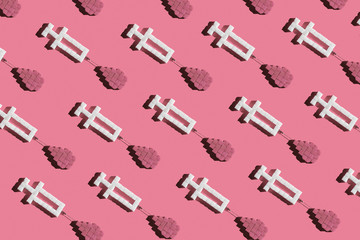 No sugar and diabetes concept. Creative pattern made with sugar cubes. Syringes with blood drops.