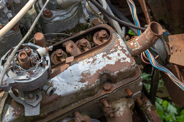 Parts of old abandoned rusty vehicles, crushed cars in scrapyard, junk yard needed to be utilised and reused to protect nature and environment, metal recycling concept