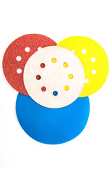 Set of abrasive tools different colors on white background