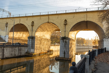 View of the old bridge over the river. Arched spans