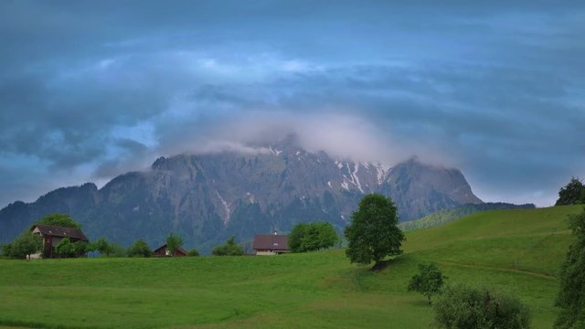 Village Horw, Mount Pilatus, Switzerland, May 13, 2018. Zoom view of Mount Pilatus, clouds float near the mountain. Time Lapse video of Mount Pilatus.