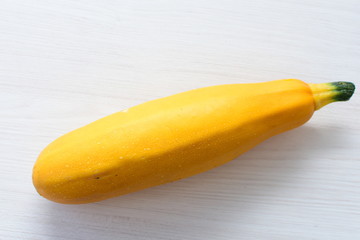 Natural, whole and chopped yellow zucchini