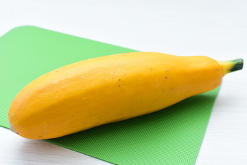 Natural, whole and chopped yellow zucchini