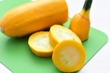 Natural, whole and chopped yellow zucchini