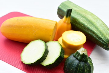 Natural, whole and chopped yellow zucchini