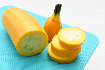 Natural, whole and chopped yellow zucchini