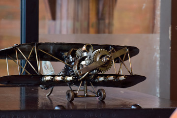 The plane is a toy made of steel and various equipment. Assembled together