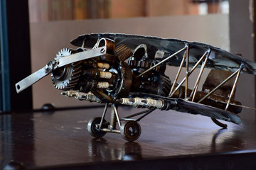 The plane is a toy made of steel and various equipment. Assembled together