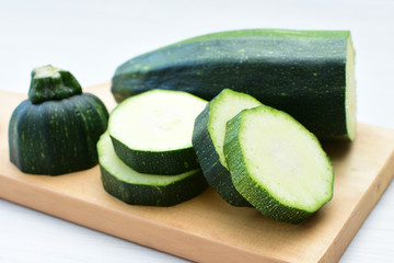 Natural, whole and chopped yellow zucchini