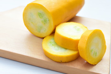 Natural, whole and chopped yellow zucchini