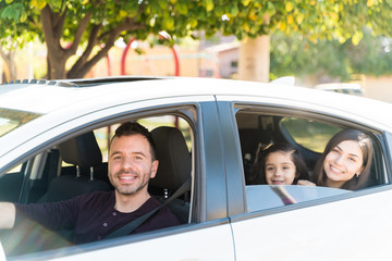 Happy Family Going For Picnic In Car