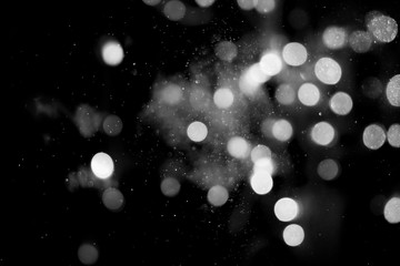 Abstract white bokeh on a black background  © wanchai