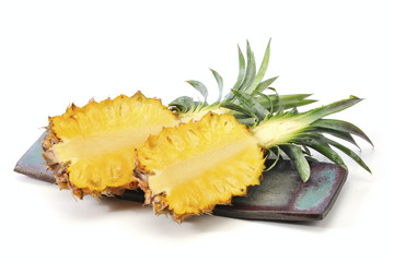 Sliced Pineapple on the plate at the white background