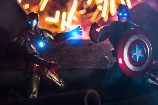 TOKYO, JAPAN - February 5, 2020 : Fighting pose of Iron Man and Captain America figures in fire sparks. These is a fictional superhero appearing in American comic books published by Marvel Comics.