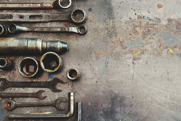 Flat lay Old hand tools ,Pliers screwdriver wrench rusted iron metal tools on Steel plate at garage