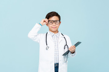 Smiling smart doctor boy with white medical coat and stethoscope - Powered by Adobe