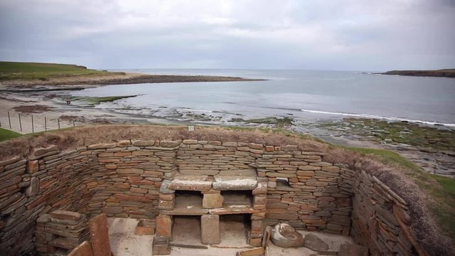 An uncovered dwelling at Skara Brae in Scotland showing the proximity of the sea coast to the settlement.