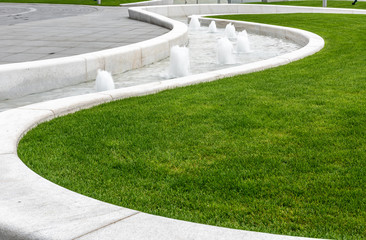 Fountain device in garden landscape 