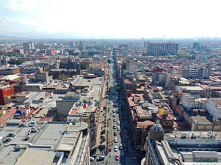 Fototapeta na wymiar Historic center of Mexico City and Avenue 20 de Noviembre aerial view near Zocalo Constitution Square, Mexico City CDMX, Mexico. Historic center of Mexico City is a UNESCO World Heritage Site since 19