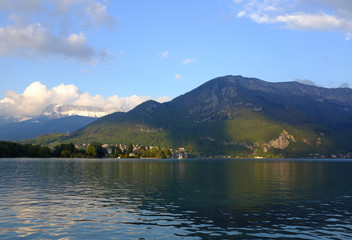 Fototapeta premium View of the mountains and Lake Lac d'Annecy at sunset on April 28, 2017 in Annecy, France.