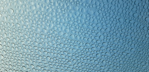 water drops on blue surface