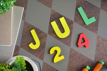 July 24, Birthday for kids with wooden text design for background.