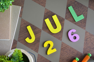 July 26, Birthday for kids with wooden text design for background.