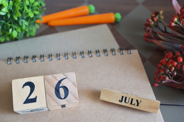 July 26, Appointment date with number cube design for background.