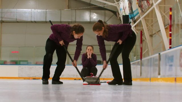 Curling training indoors - rubbing the ice before the biter