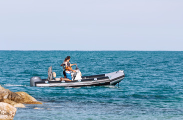 A couple in love rides on a motor boat